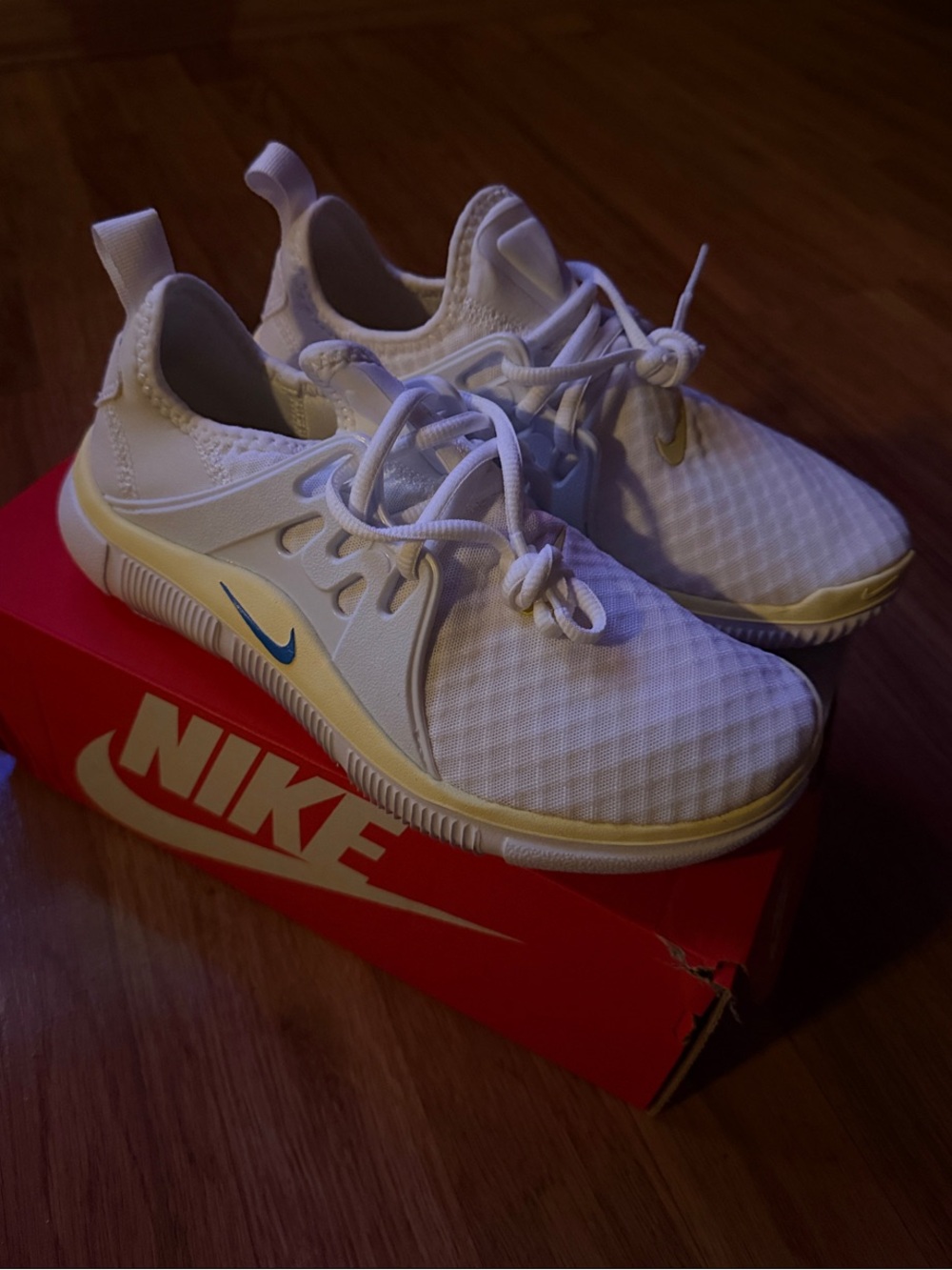 Nike White Athletic Sneakers with Blue Swoosh and Cream Trim